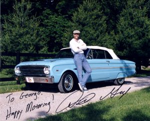 Dennis Gage Standing by Car